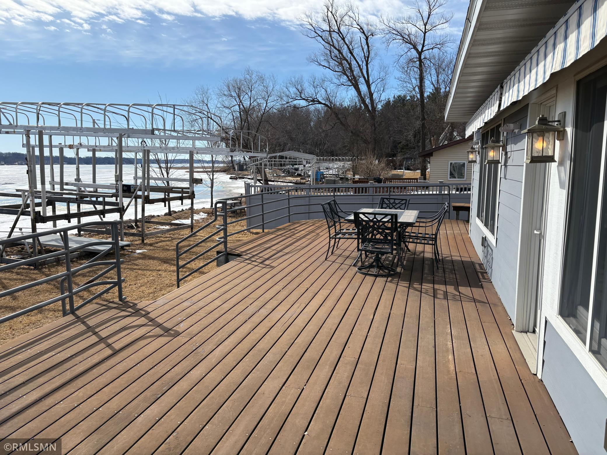 This is how summer fun should be. Plenty of space on the deck for everyone. Get the grill going and coolers out. Stroll back and forth from the lake and when the sun goes down grab your favorite beverage and just let the good times roll.