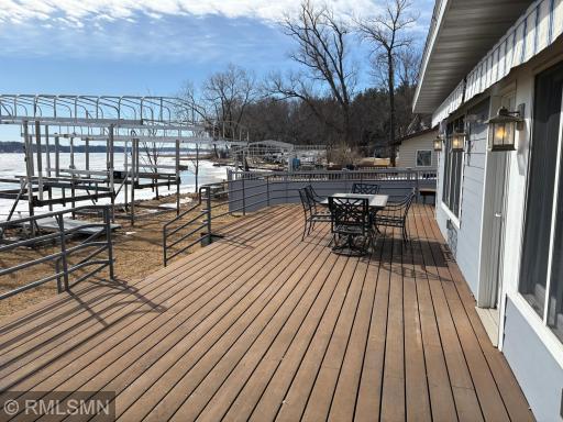 This is how summer fun should be. Plenty of space on the deck for everyone. Get the grill going and coolers out. Stroll back and forth from the lake and when the sun goes down grab your favorite beverage and just let the good times roll.