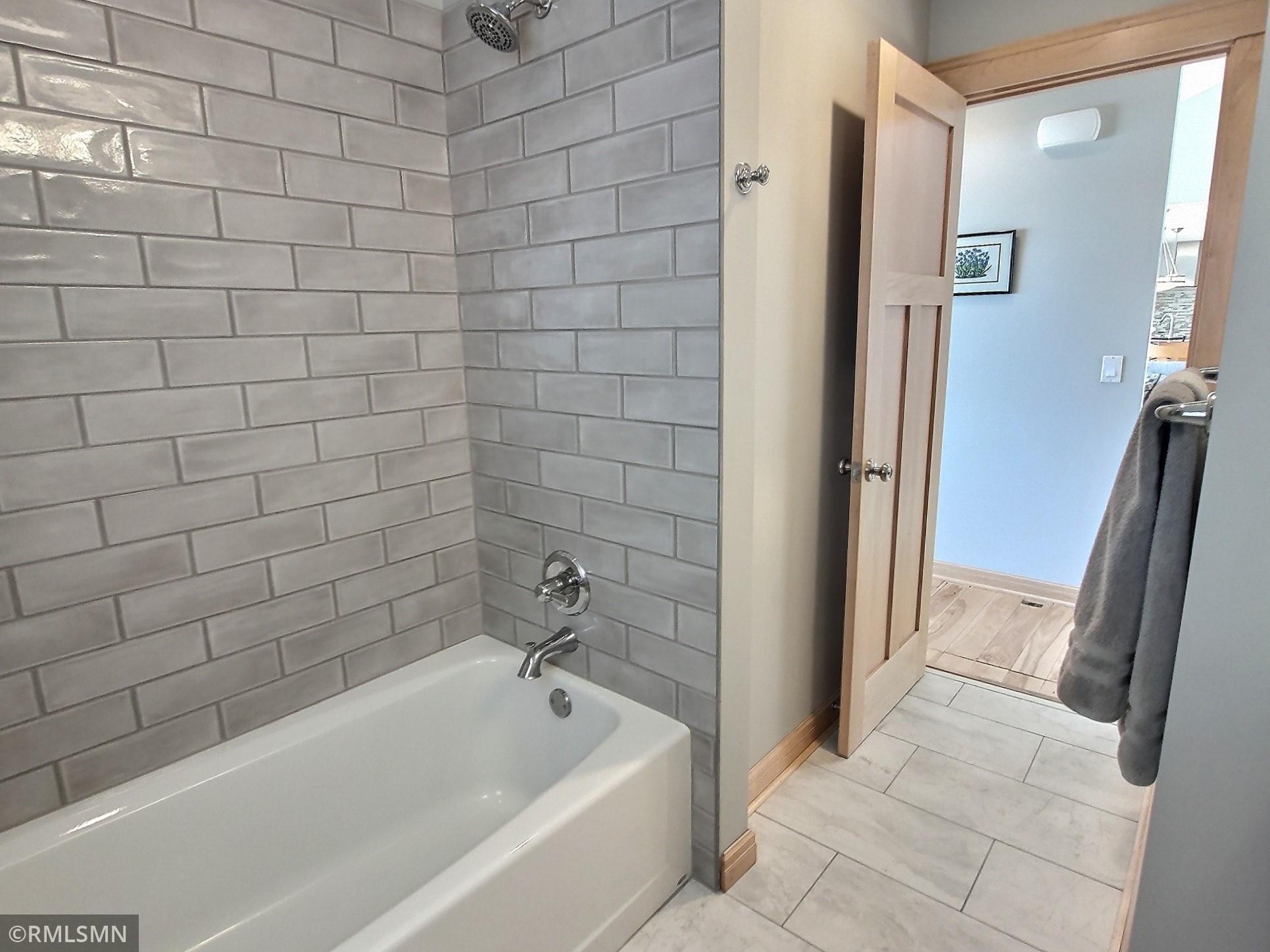 The full main level bath just completed a new tile upgrade bringing a fresh new look to the bathroom.