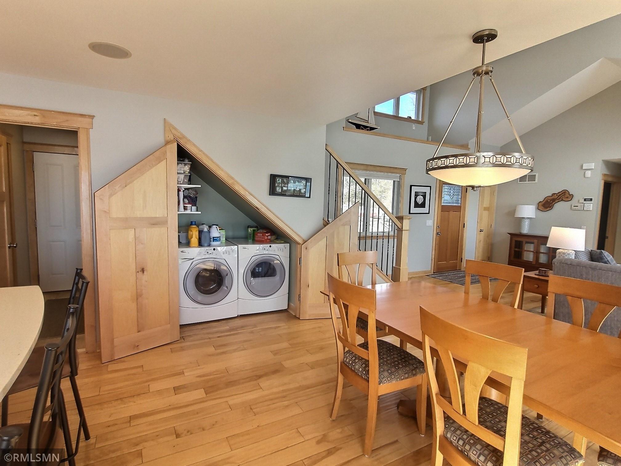 This cool design feature and good use of space in the home is the laundry area is underneath the stairs.