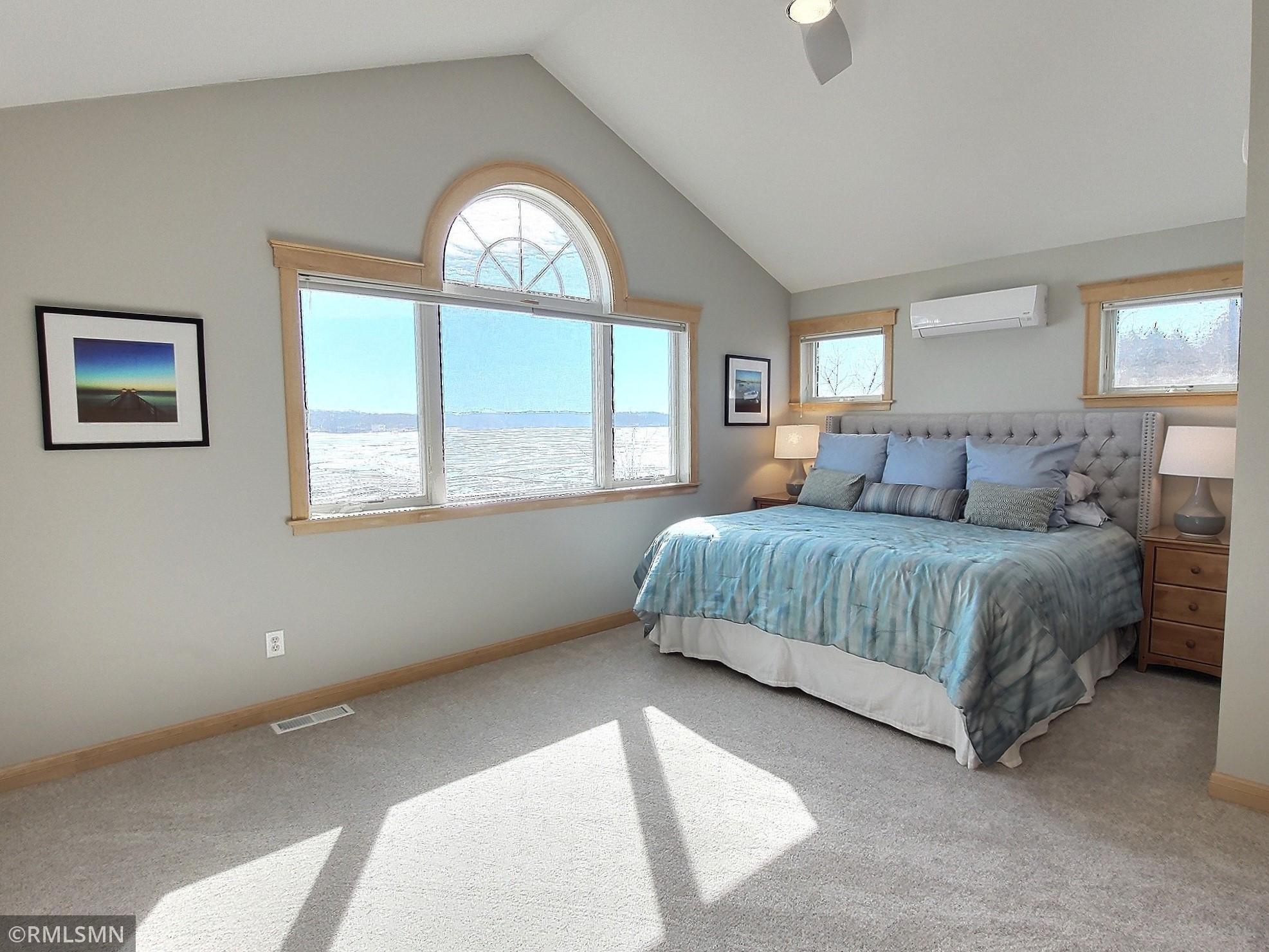 The upper level consists of the primary bedroom and bath and flex room above the garage. Incredible views of the lake when you wake in the morning.