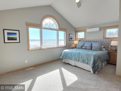 The upper level consists of the primary bedroom and bath and flex room above the garage. Incredible views of the lake when you wake in the morning.