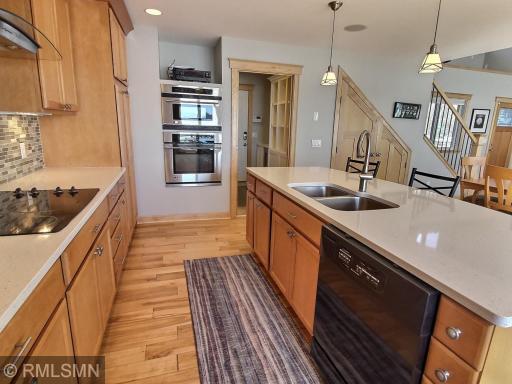 Another view of the kitchen and also in the background you see the mid room with a built in nook and wine fridge. The mechanical room is also located in this area.