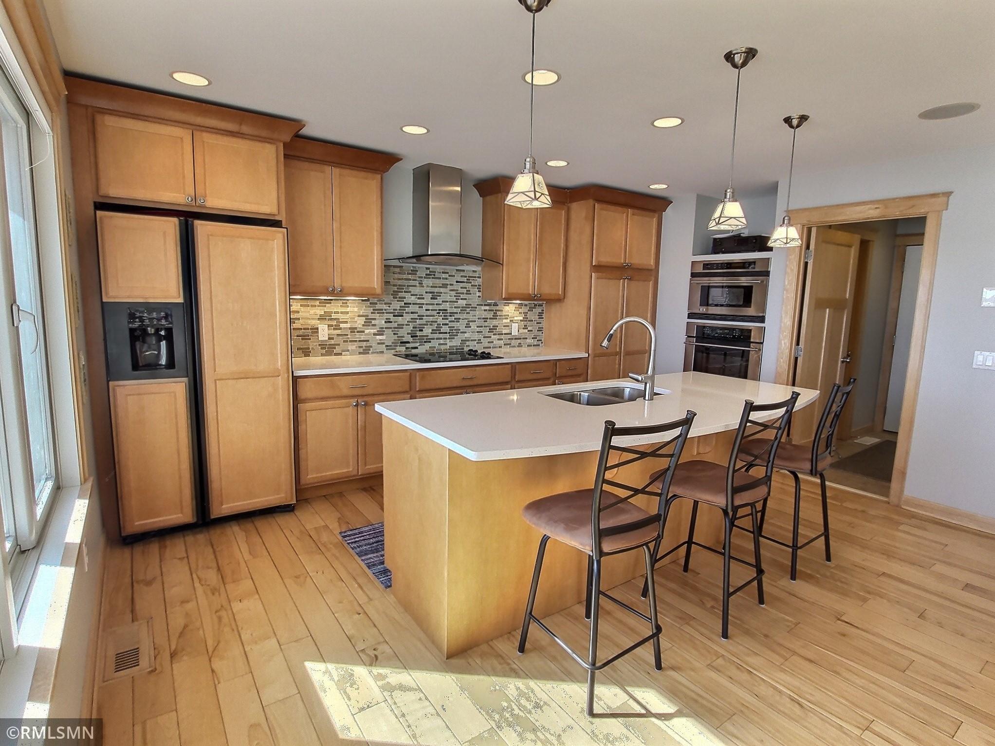 The kitchen is tastefully finished and opens up to the rest of the main level perfect when entertaining at the lake. The center island work station keeps you a part of the conversation.