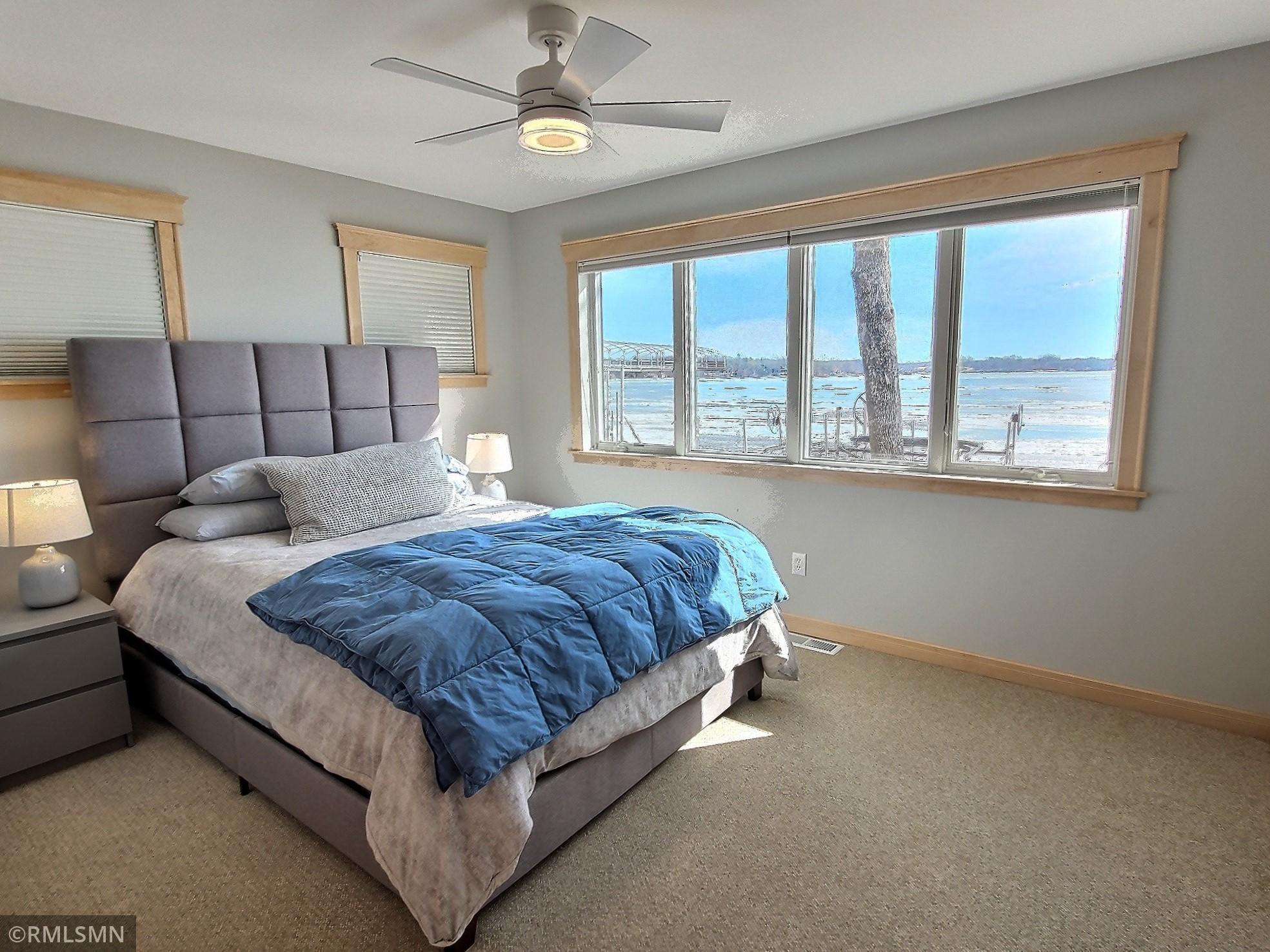 The 2nd main level bedroom is lakeside, one of your guests is going to wake up to this gorgeous view.
