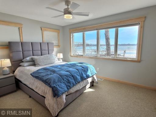 The 2nd main level bedroom is lakeside, one of your guests is going to wake up to this gorgeous view.