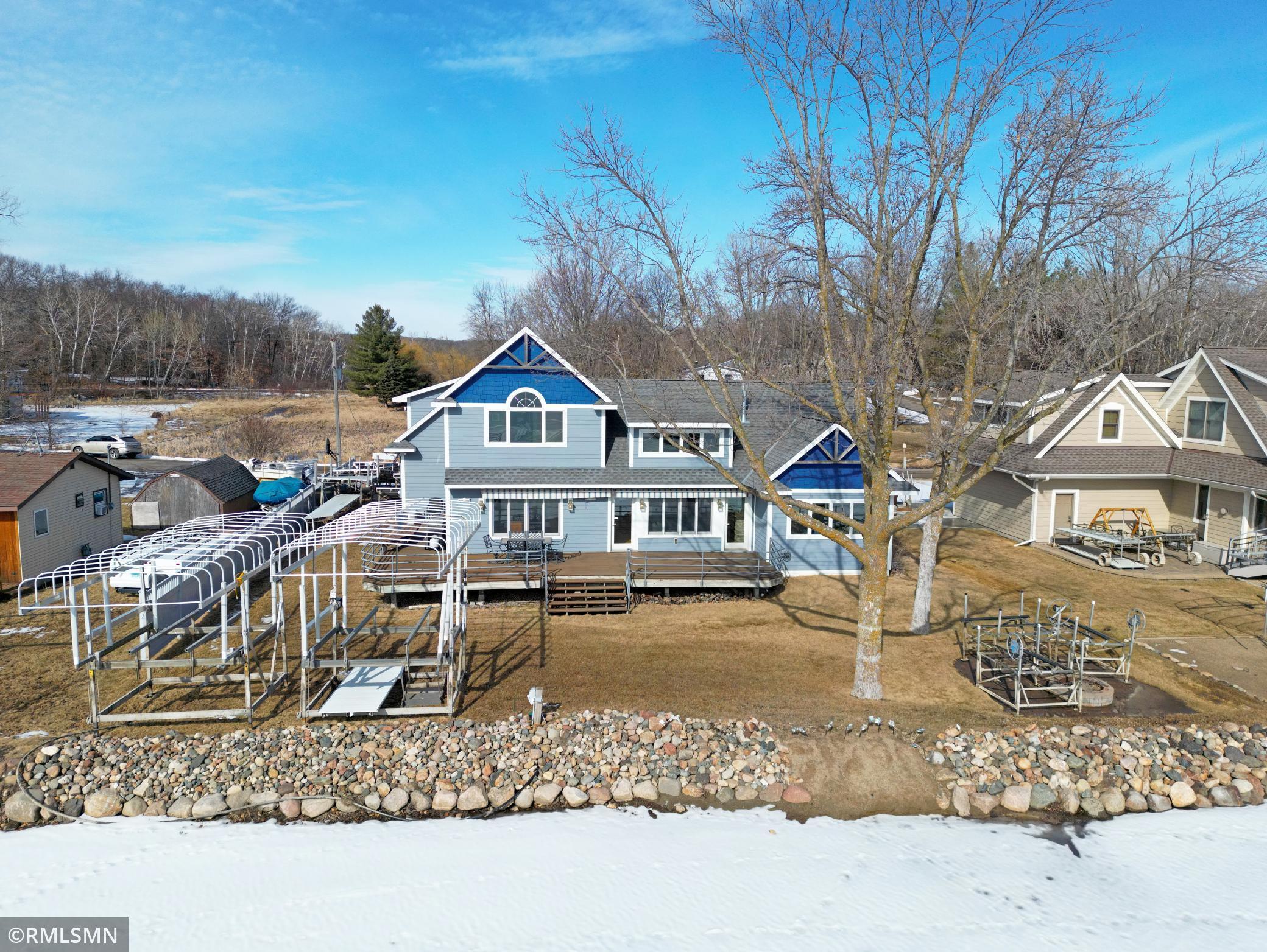 The best of elevation on this prime Sugar lake lot. Check out the deck, now this is the size of the deck you need lakeside. Just a little meandering stroll down to the lake.