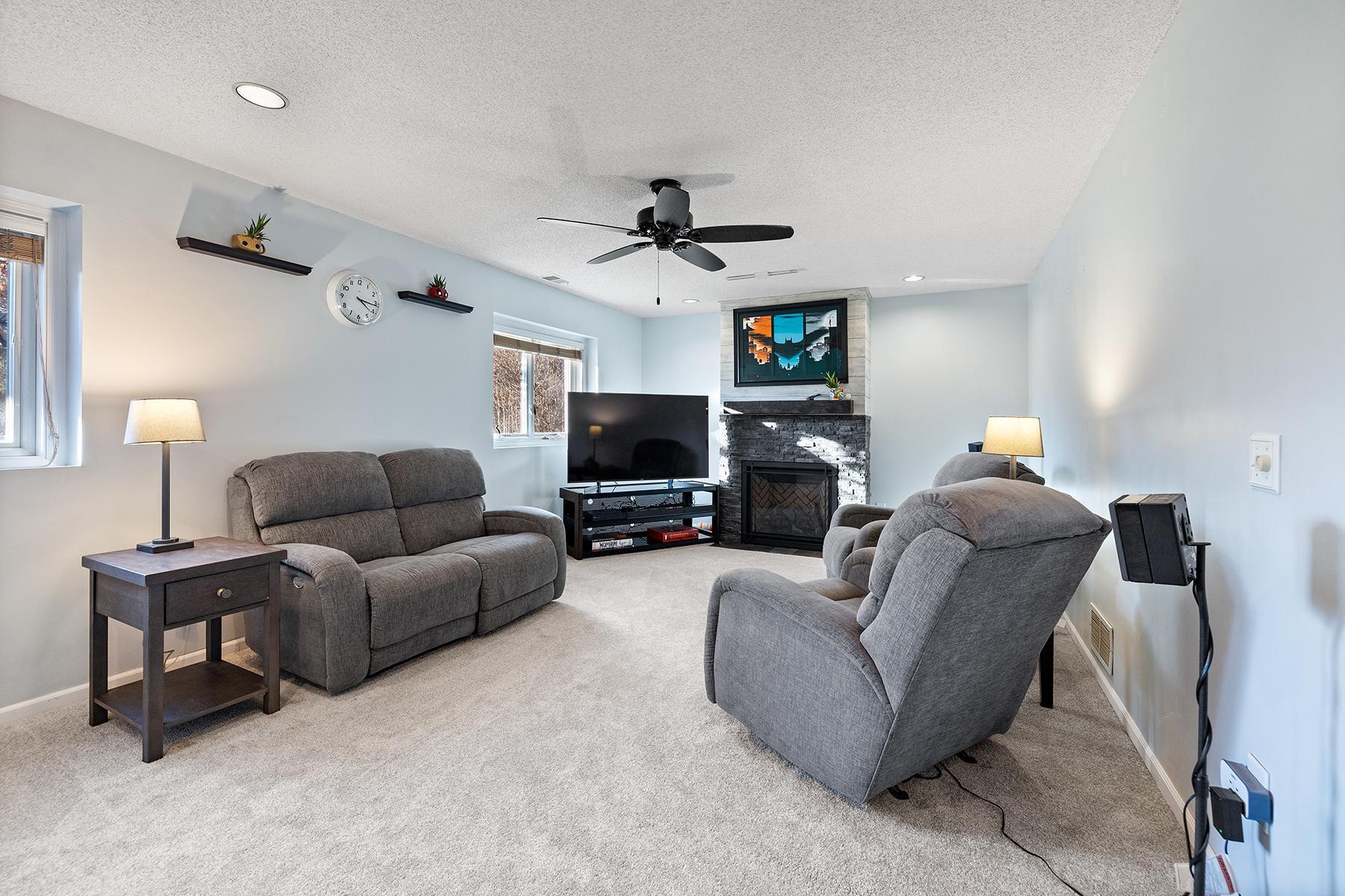 Lower level family room with built in gas fireplace