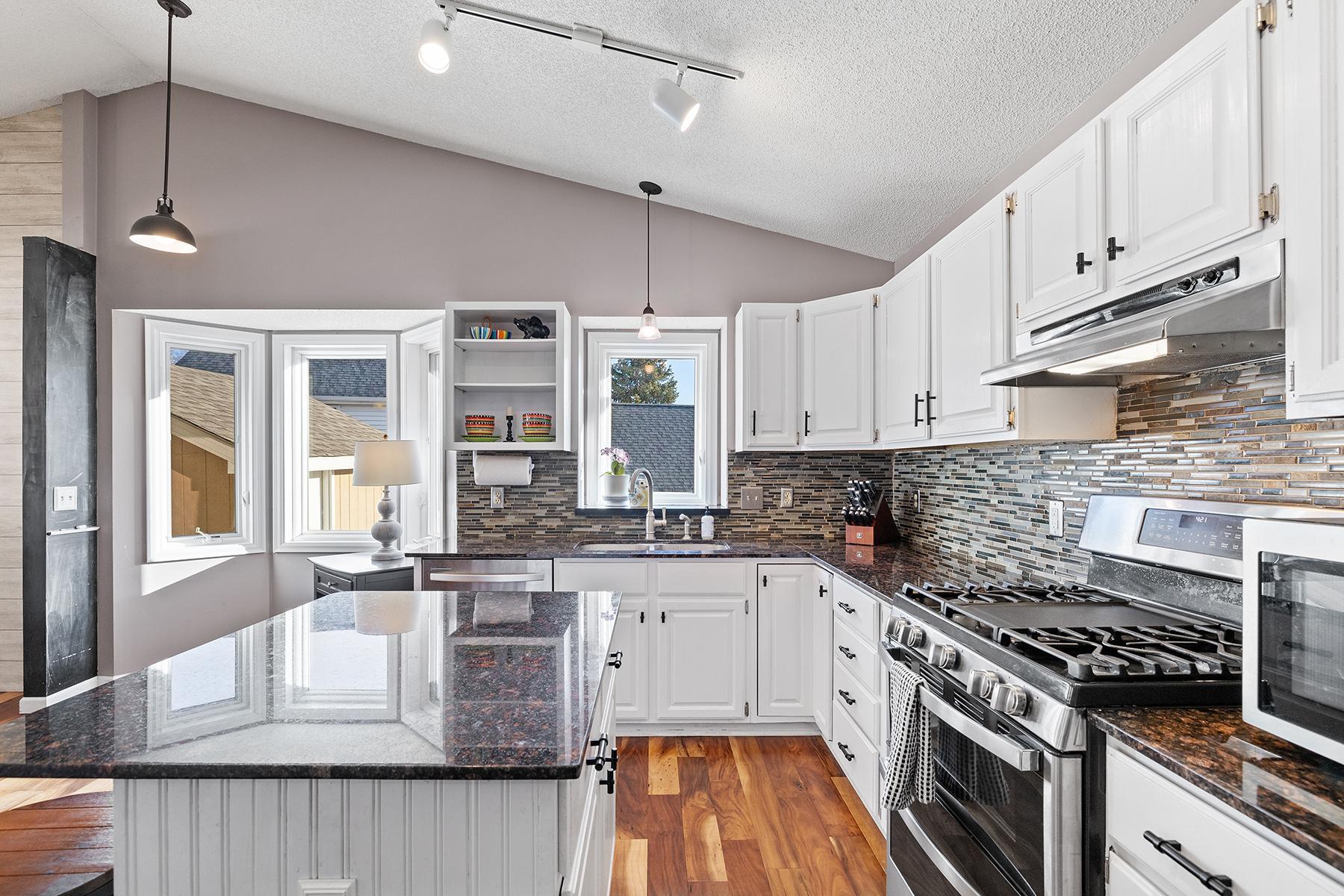 Tasteful backsplash and large center island