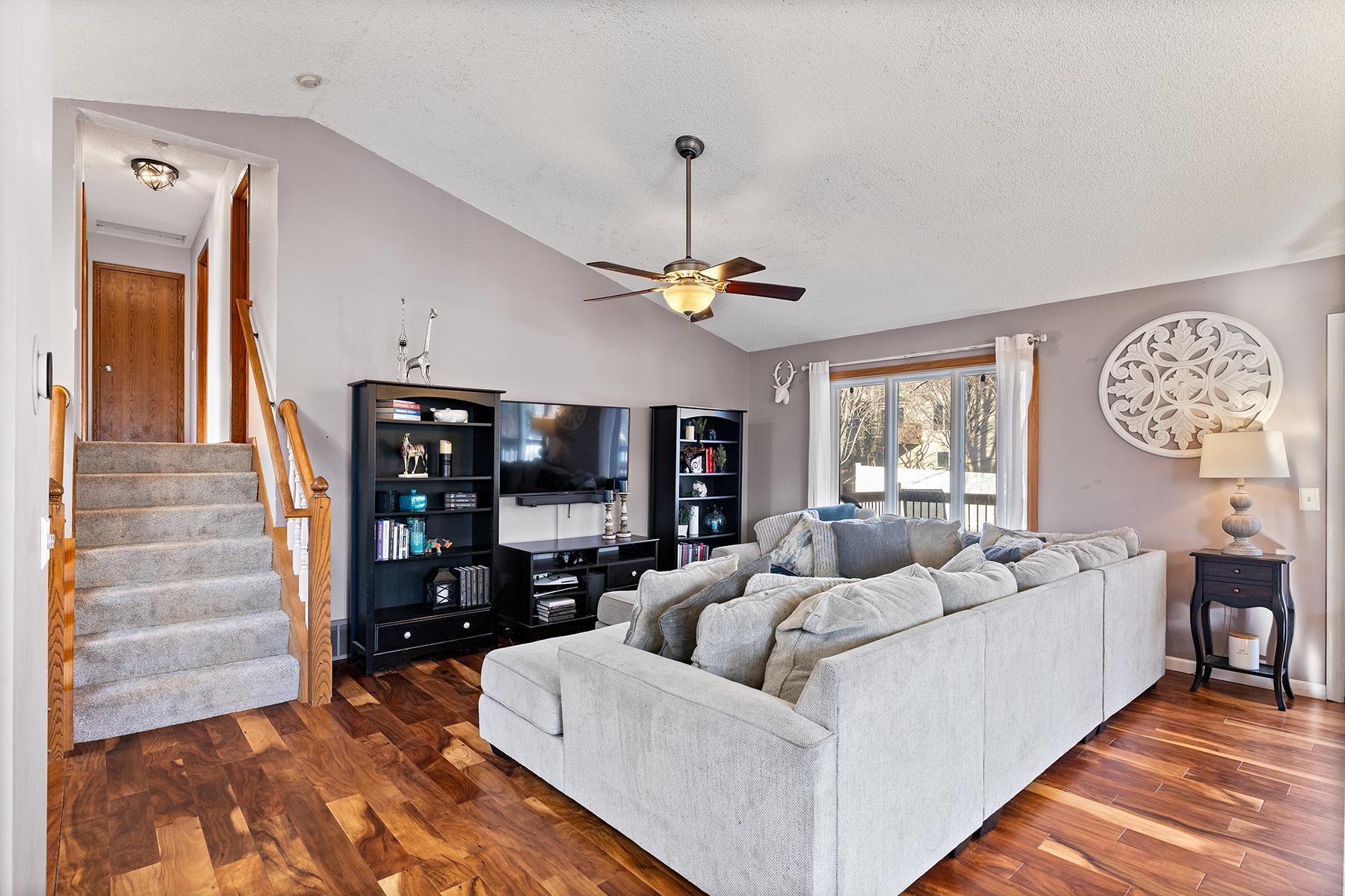 Main level living room, 3/4 bathroom is first door on the right up the stairs