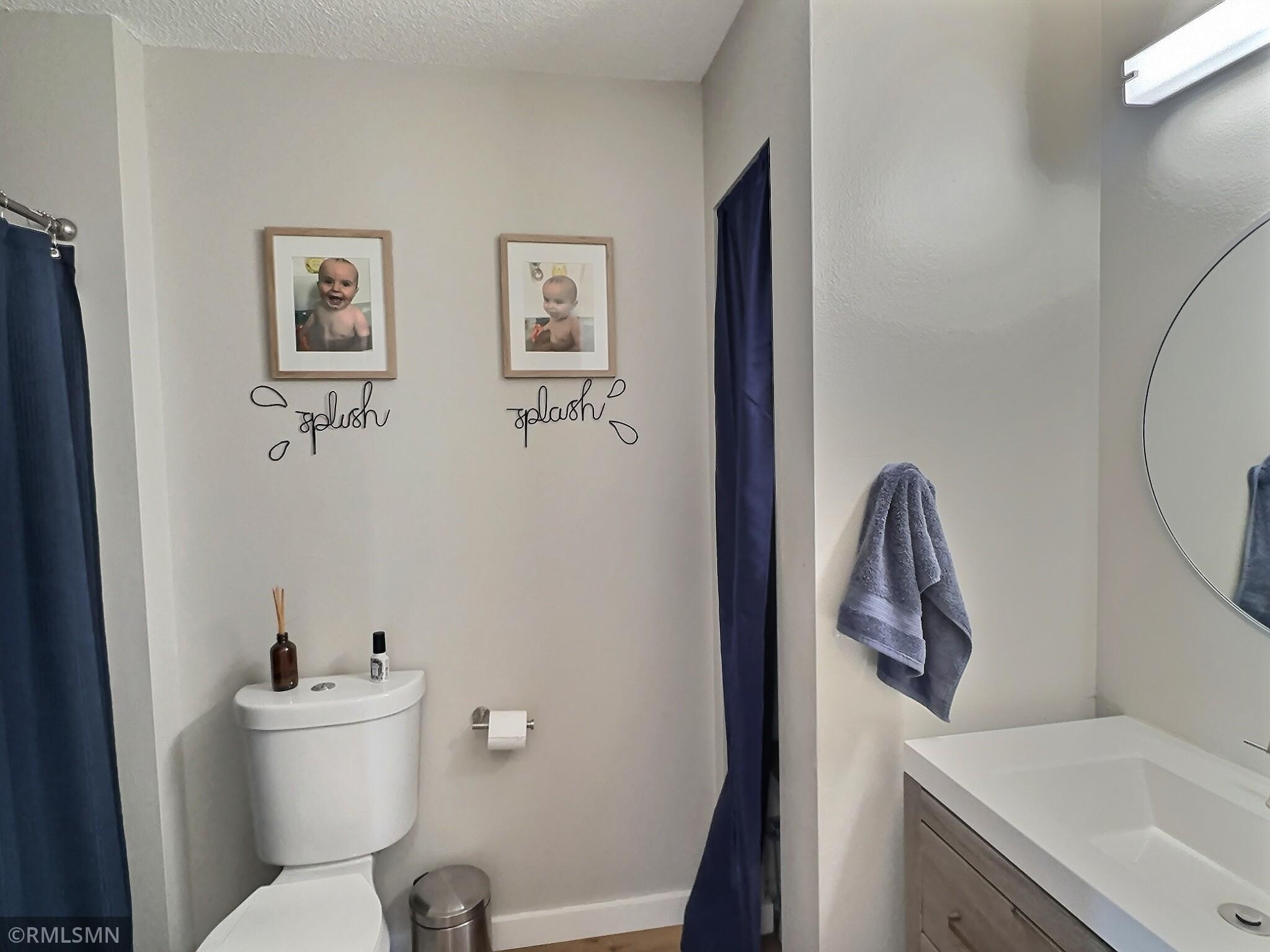 Centrally located, the full bathroom is wonderfully updated and just down the hall from all main-level bedrooms.