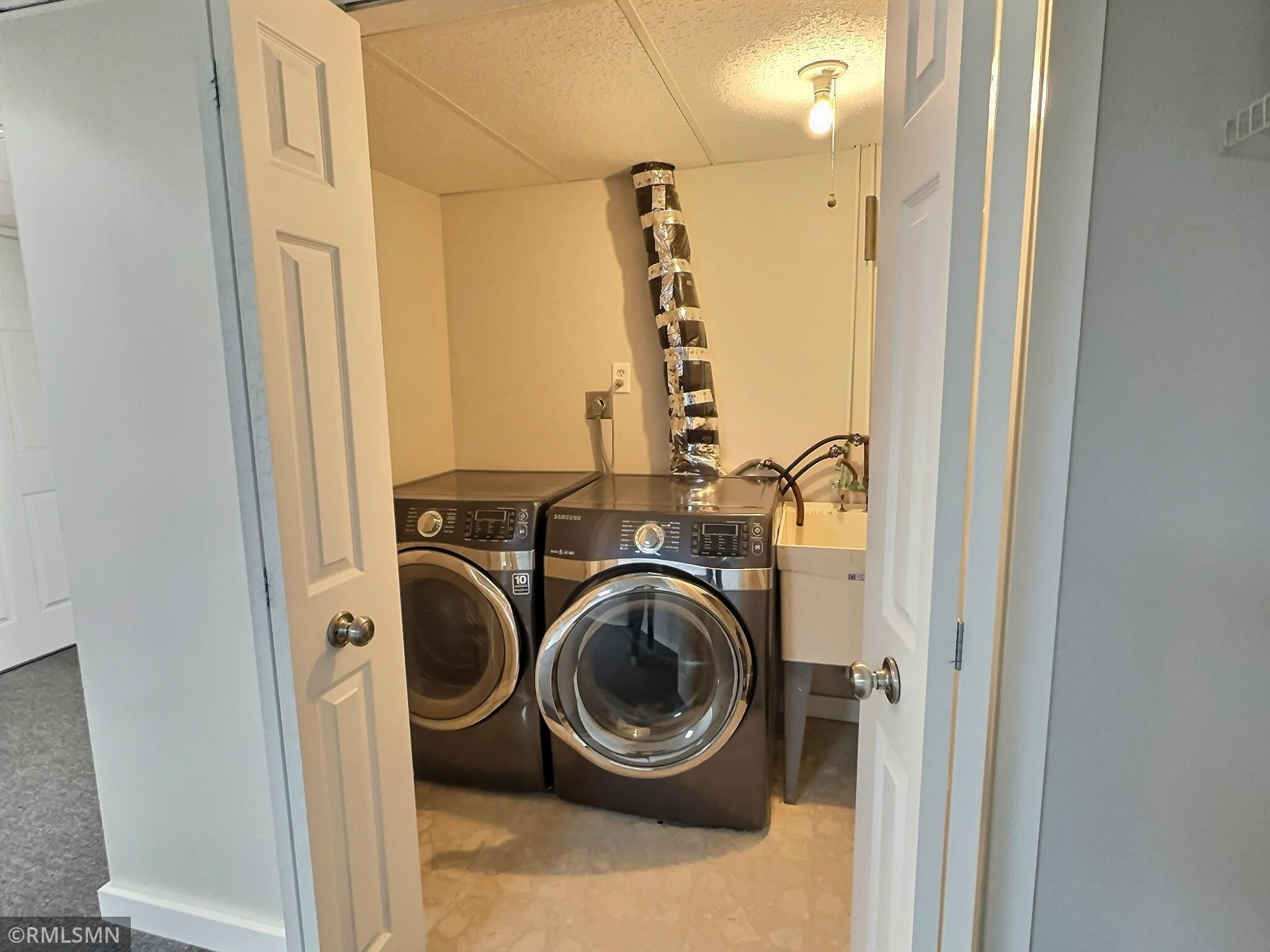 The dedicated laundry space has enough room for a utility sink and to also keep all your laundry organized.