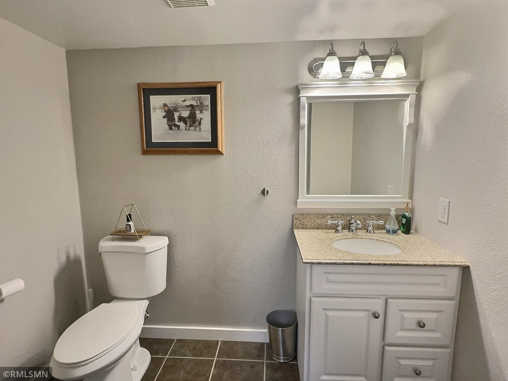 Recently completed half bathroom with tile floor is convenient for all your guests, no need to go upstairs.