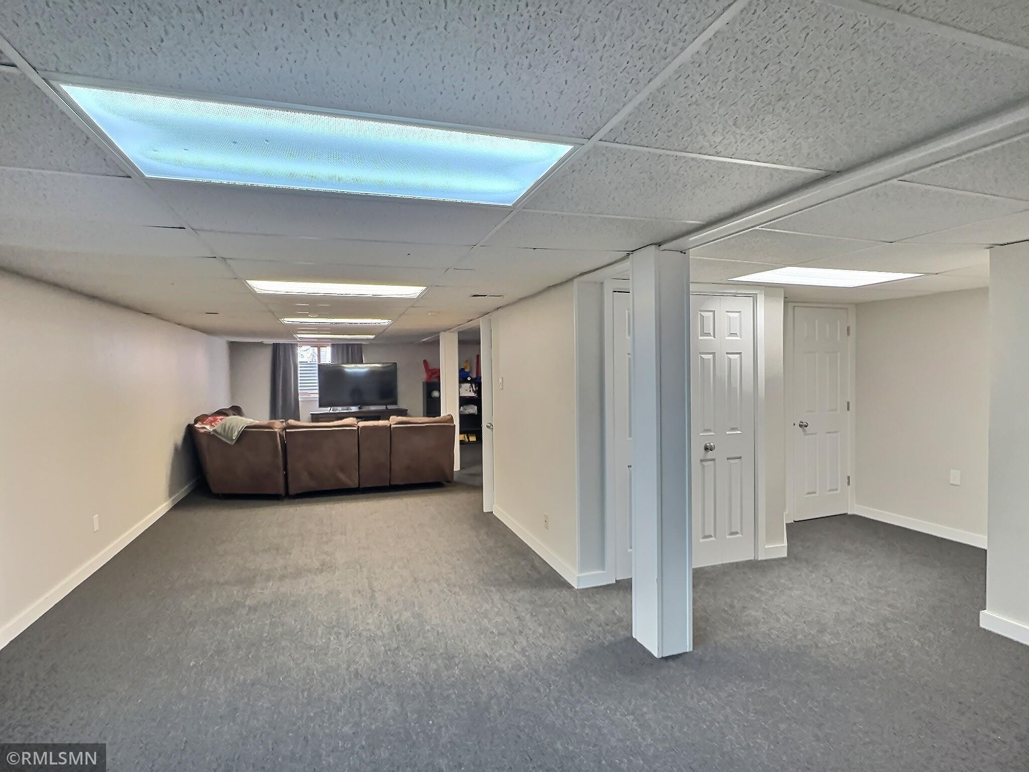 Another view of the recreation space, to the right is the utility room and under stair storage space.