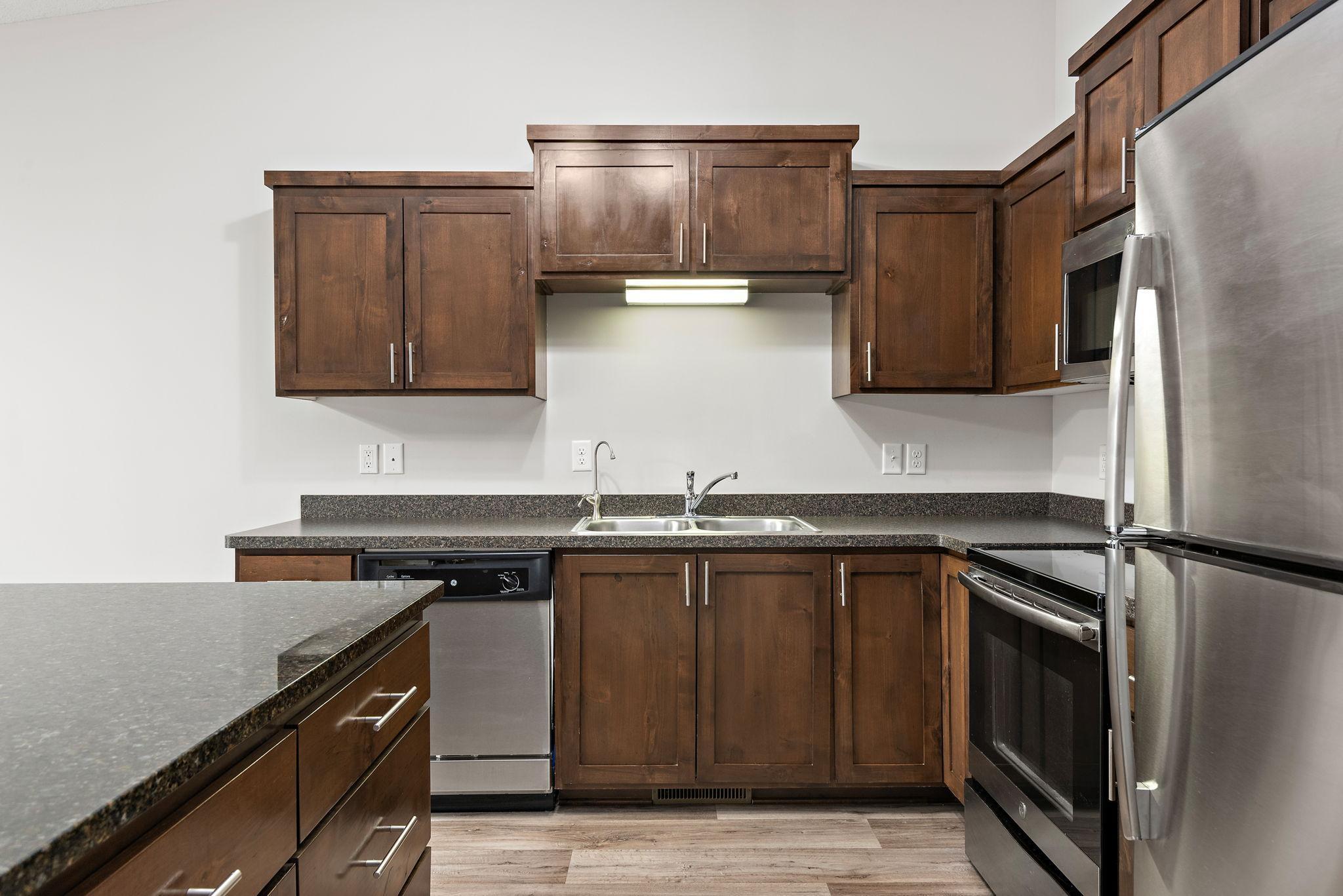 Nice Kitchen with Granite Center Island, Stainless Steel appliances and Open to Dining Room and Living Room