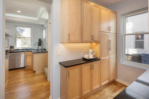 Butler's pantry adjacent to the kitchen offers an abundant amount of storage.