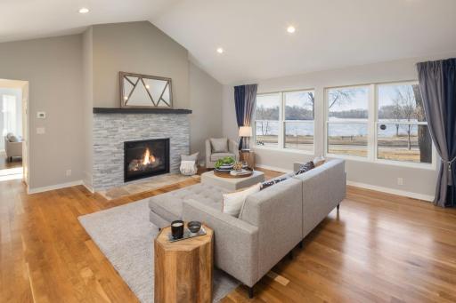 Cozy up to the fireplace in the main level family room while enjoying lake views.