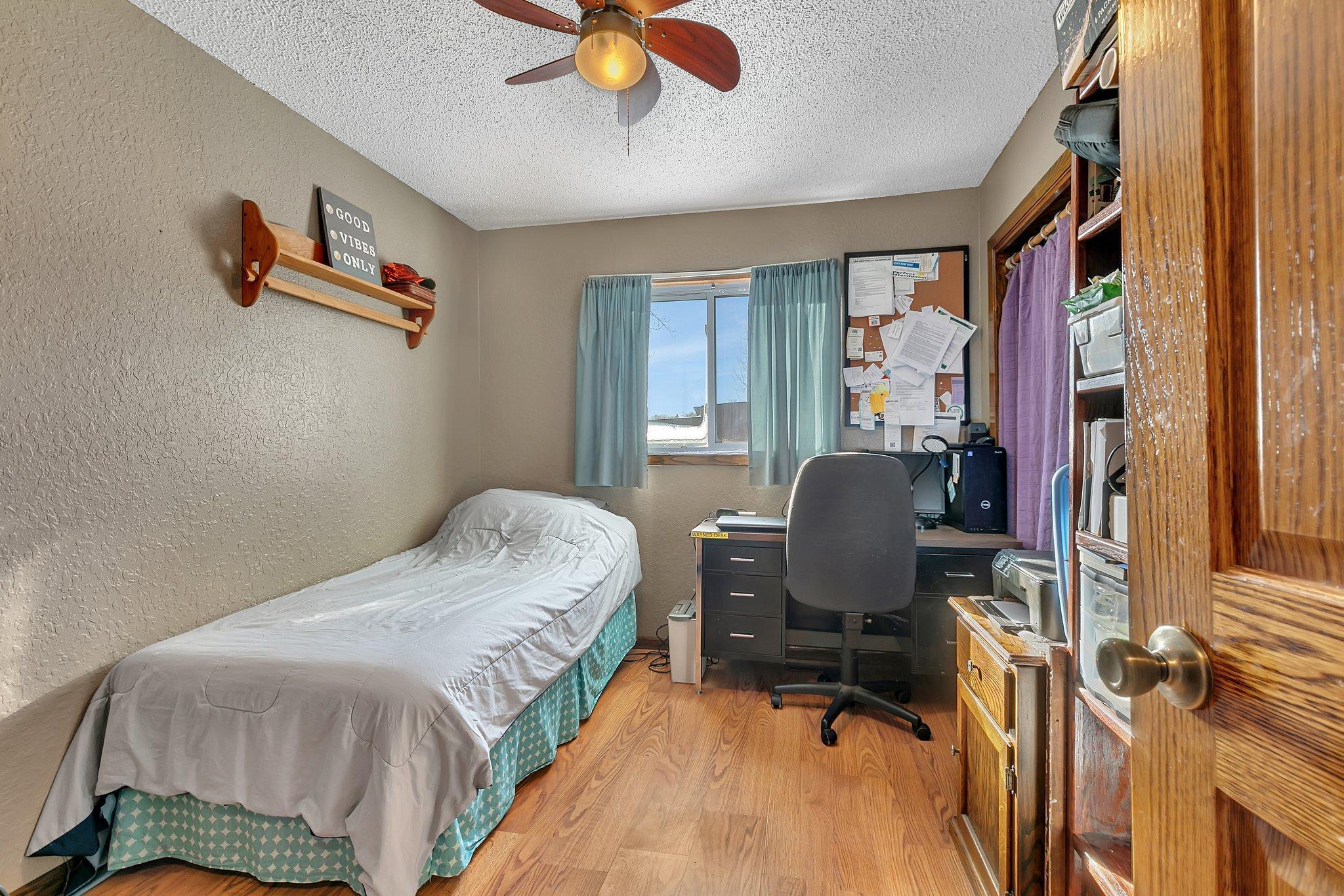 One of three upper level bedrooms.