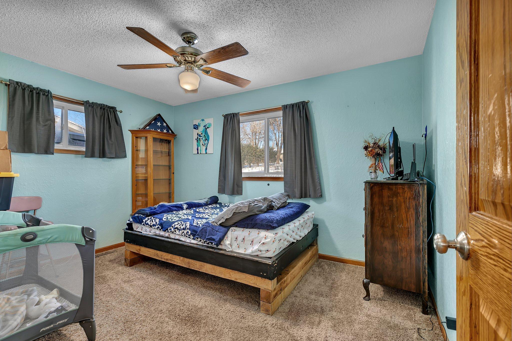 One of three upper level bedrooms.