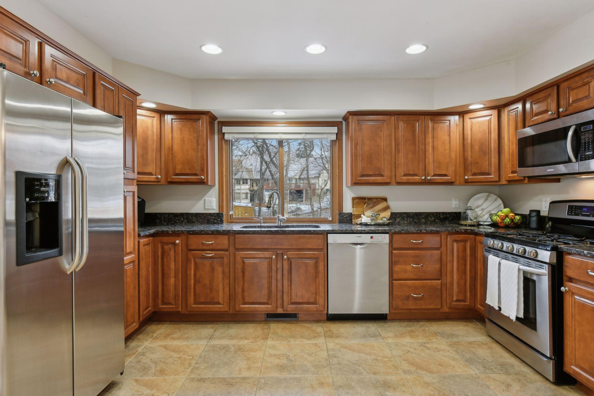 The kitchen features italian porcelain tile flooring.