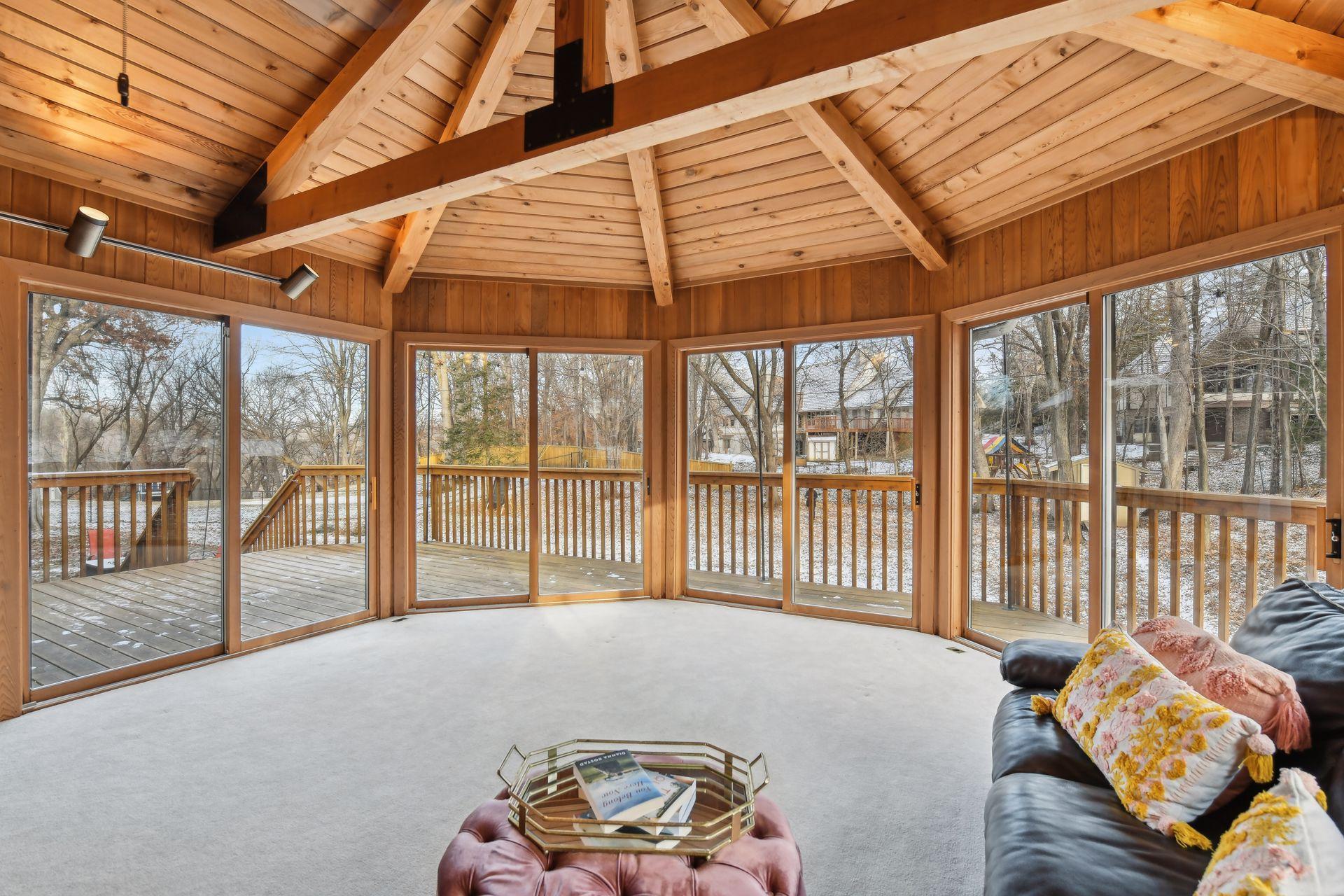 Surrounded by windows and access to the deck.