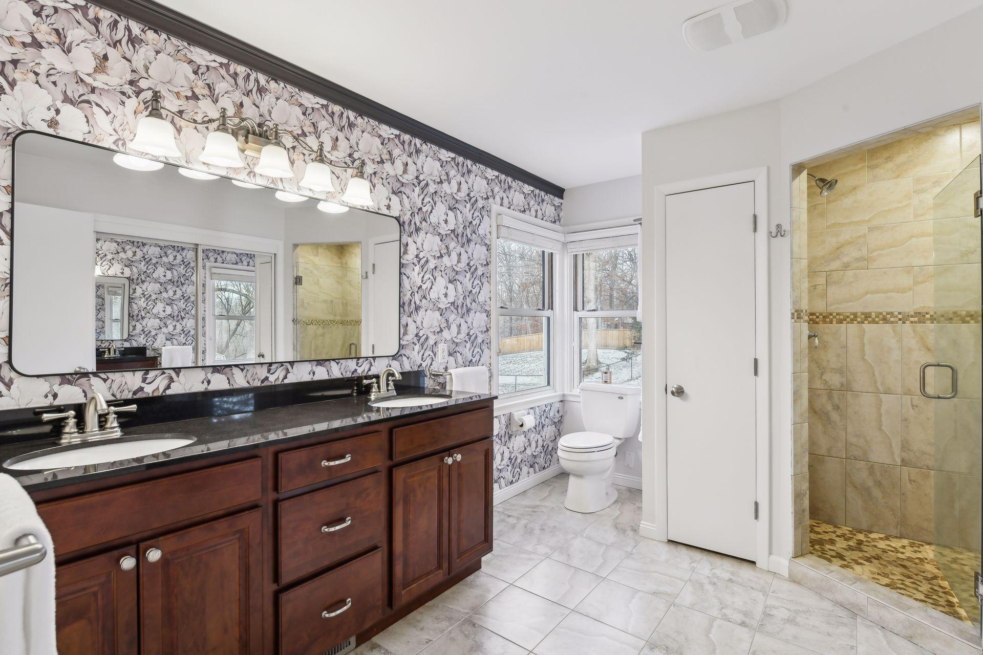 Luxurious en-suite bathroom with travertine tile.
