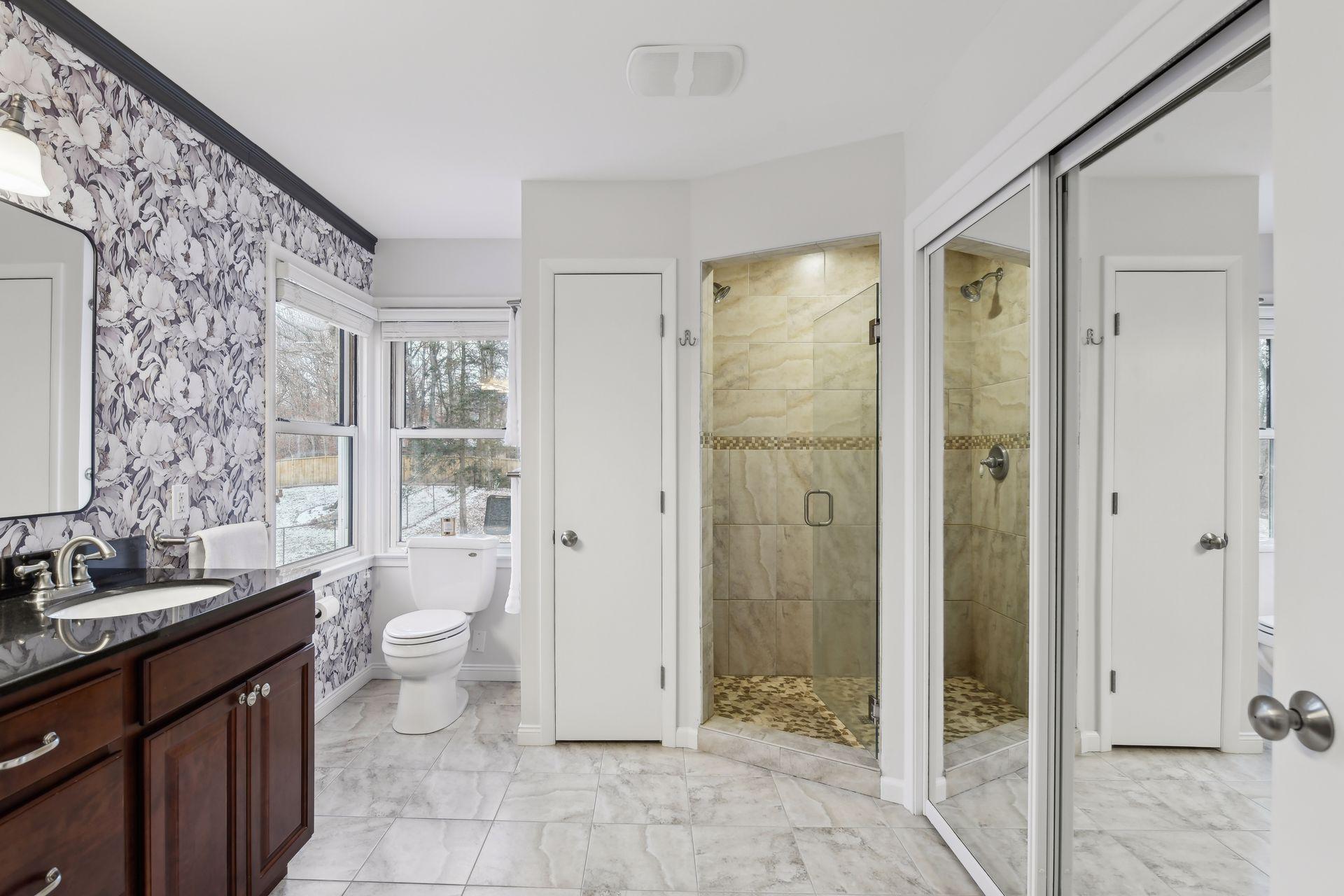 Walk-in shower with exquisite tile work.