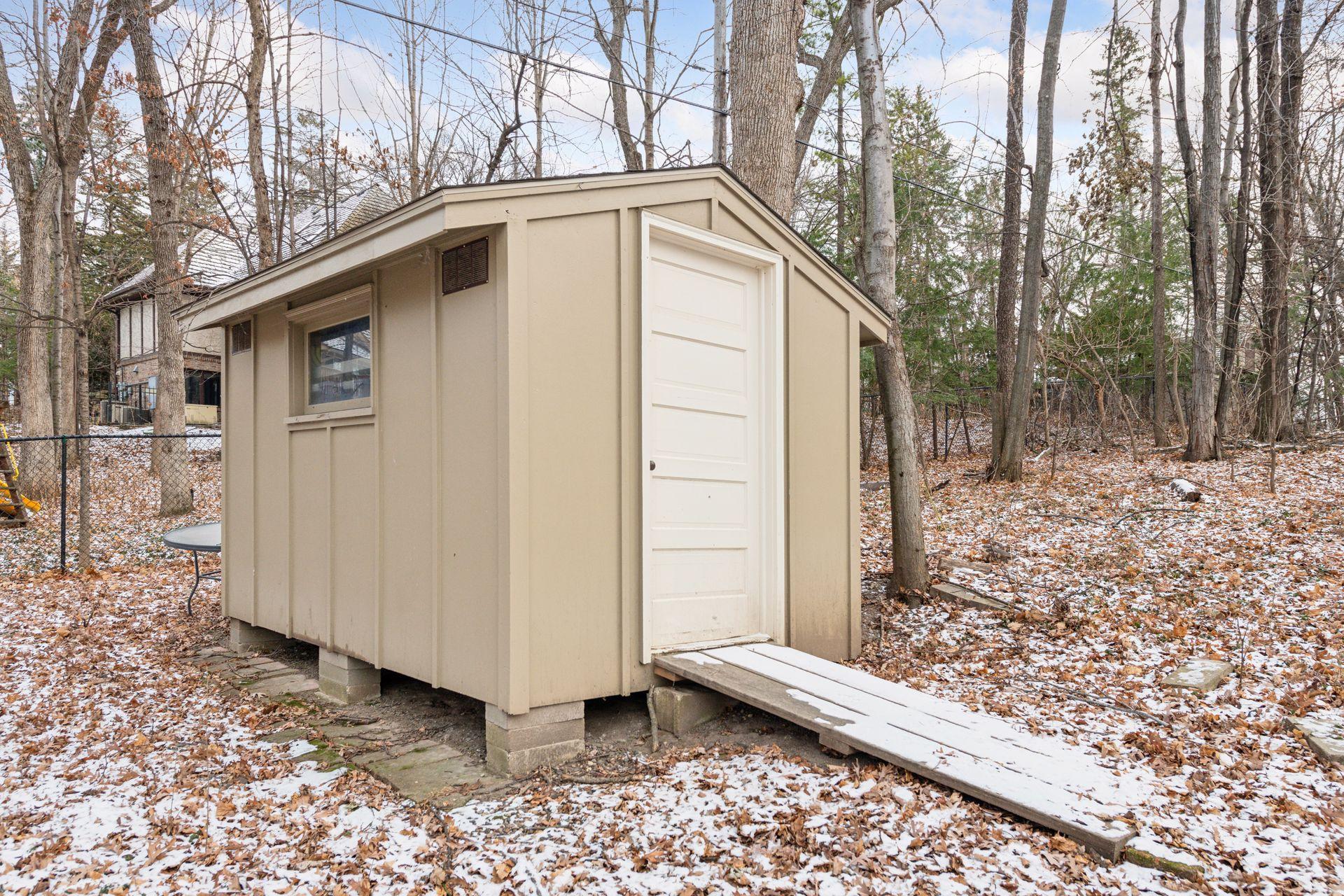 Large shed for extra outdoor storage.