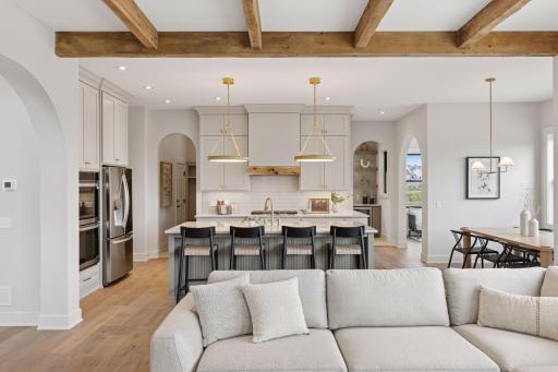 Custom, enameled cabinetry including soft close doors and drawers to the ceiling.