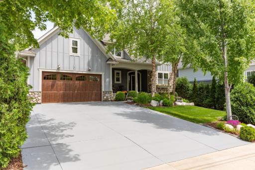 The asphalt driveway compliments the landscaping so well.