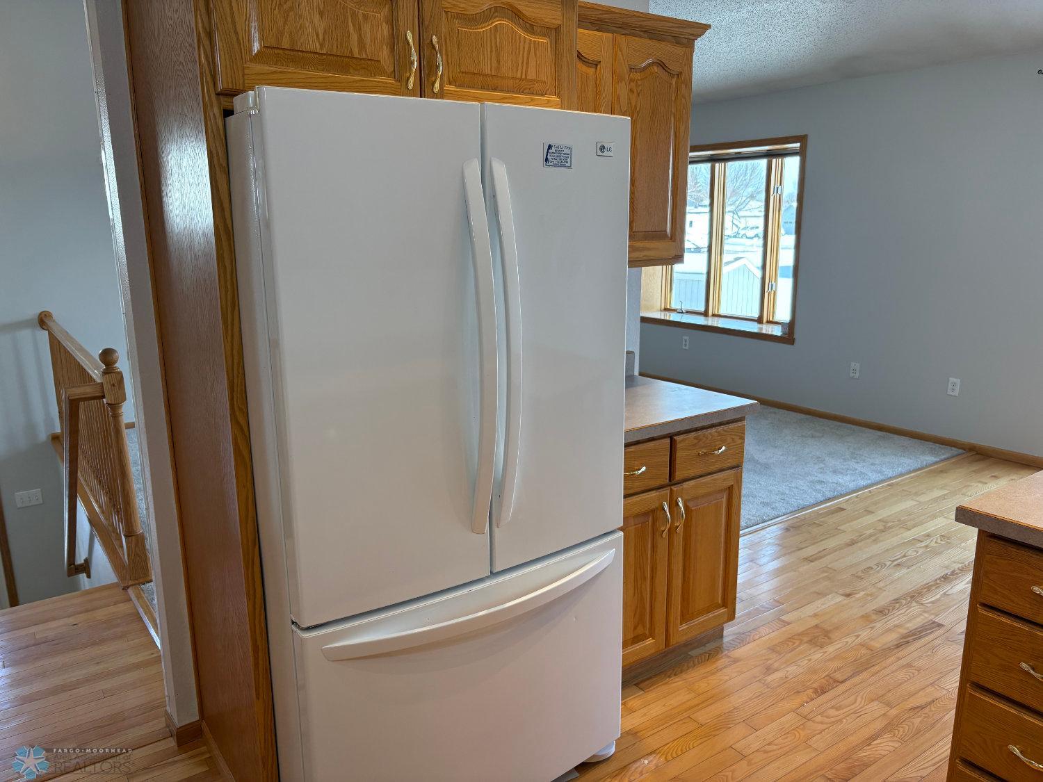 Kitchen view to refrigerator and cabinets on opposite side.jpg