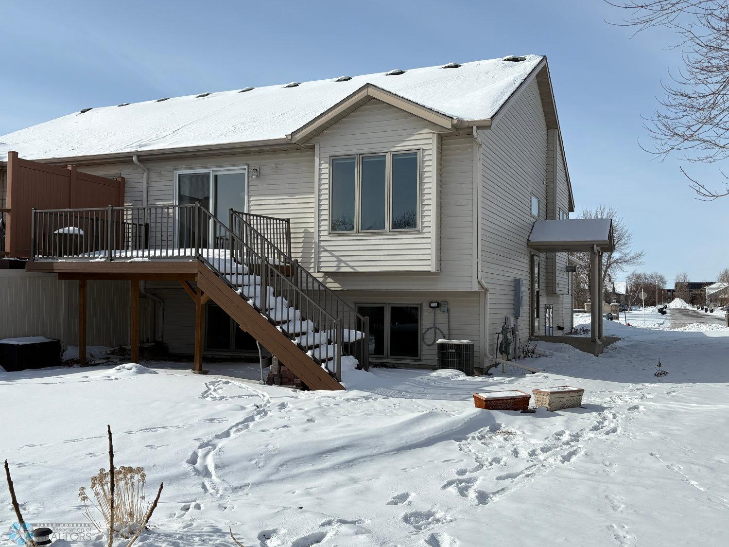 Exterior-view from back yard to steel-sided twinhome, maintenance-free deck.jpg