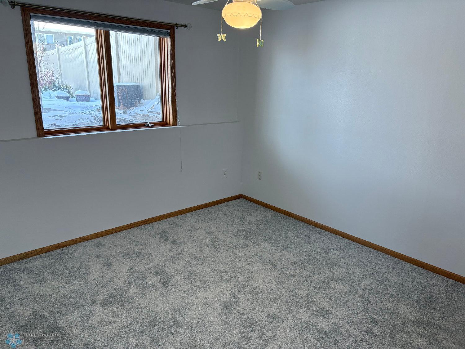 Bedroom 2 on lower level with new carpet February 2025-view 1.jpg