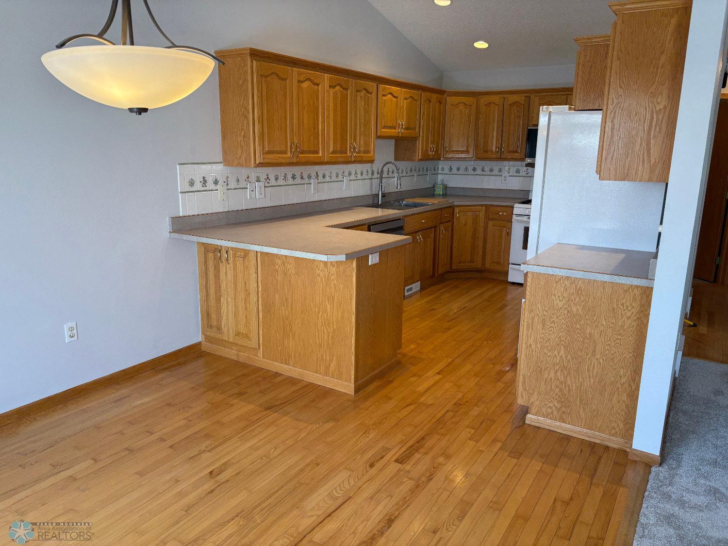 Dining room view to kitchen and breakfast bar.jpg