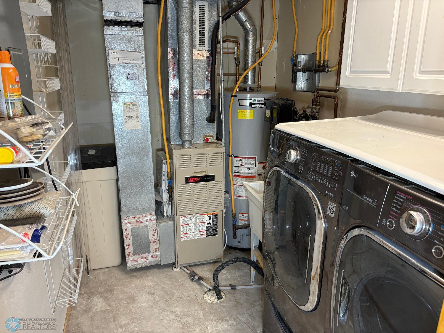 Laundry:Mechanical Room with front-loading washer and dryer included-view 1.jpg
