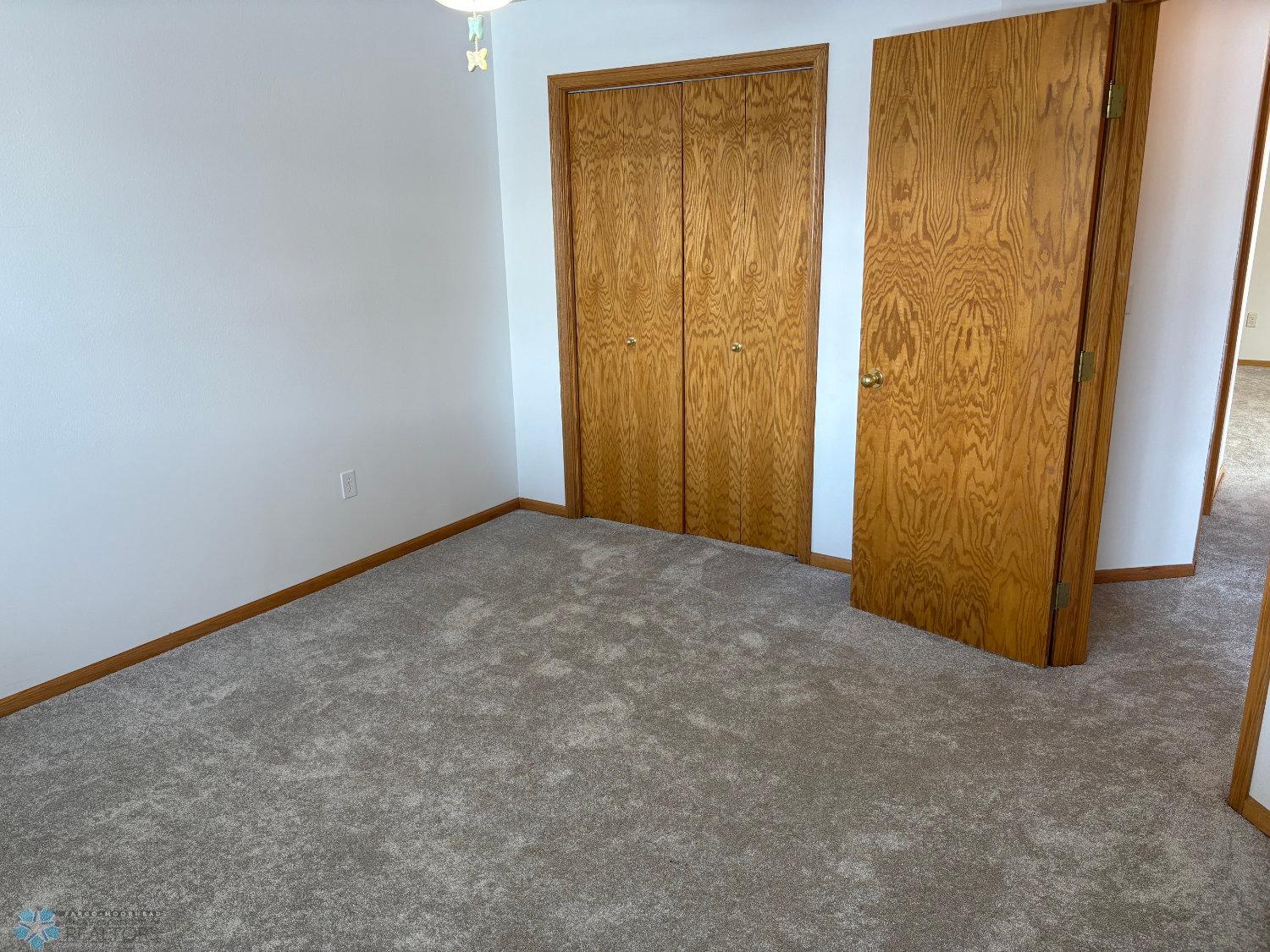 Bedroom 2 on lower level with new carpet February 2025-view 3.jpg