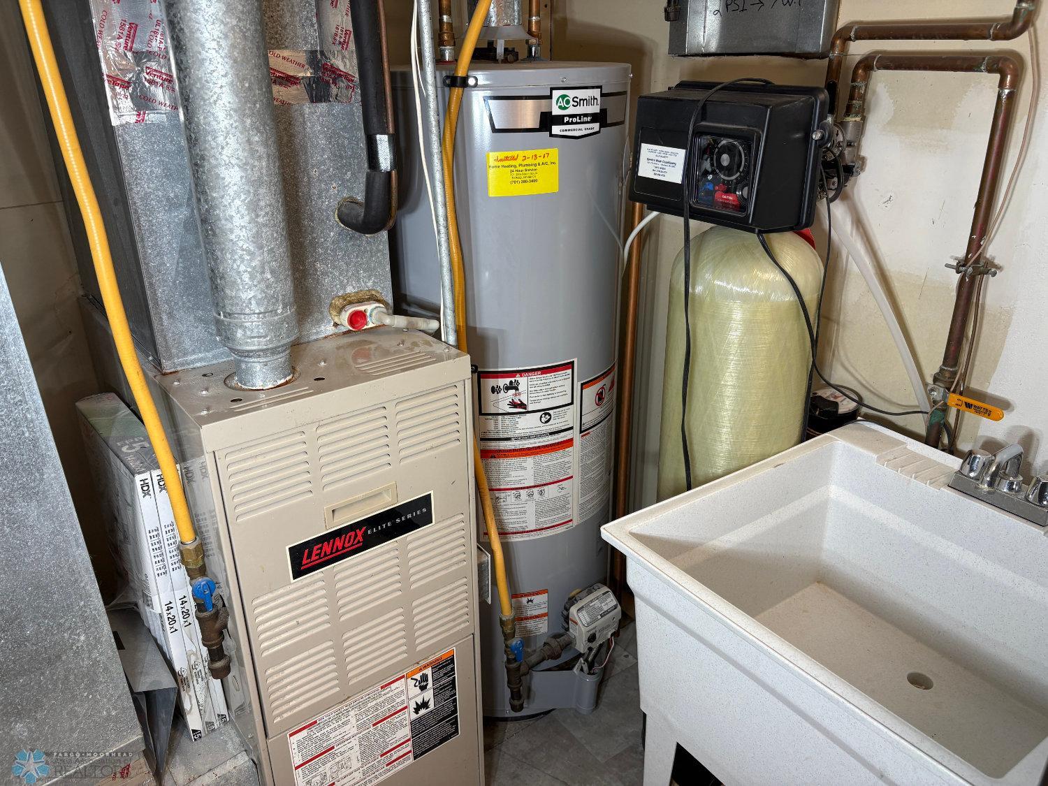 Natural gas furnace, natural gas water heater, water softener, and laundry tub in .jpg