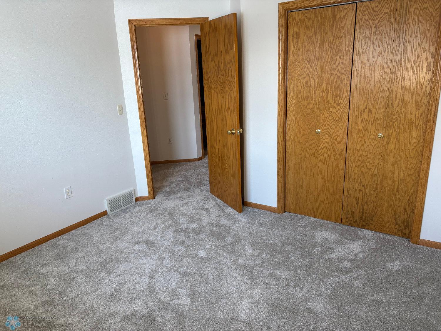 Bedroom 3 on lower level with new carpet February 2025-view 2.jpg