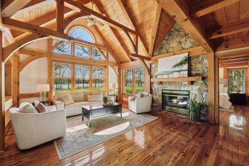 Enjoy this stunning living room with vaulted ceilings and a stone fireplace