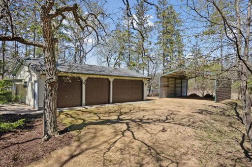 Plenty of storage with an additional 4 car detached garage and metal storage area