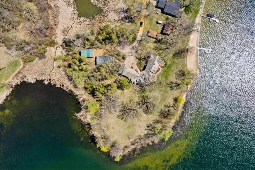 An amazing peninsula setting offering privacy wonderful panoramic lake views!