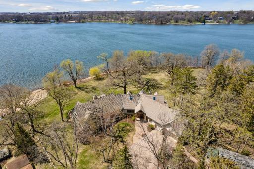 400 feet of pristine sandy shoreline and 2.4 beautiful acres on this Piersons Lake Peninsula property!