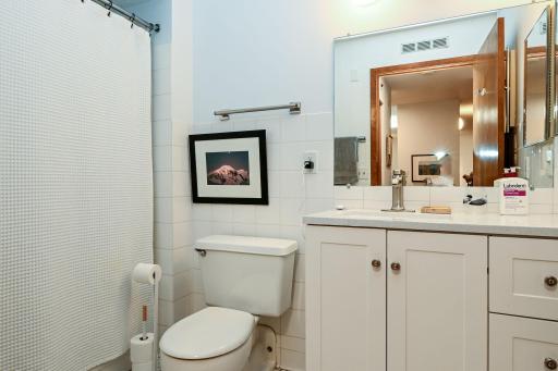 Fully bath with new vanity, tile and faucet