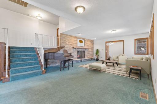 Main Level Living Room with gas fireplace! (virtually staged)
