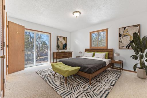 Primary Bedroom with deck access! (virtually staged)