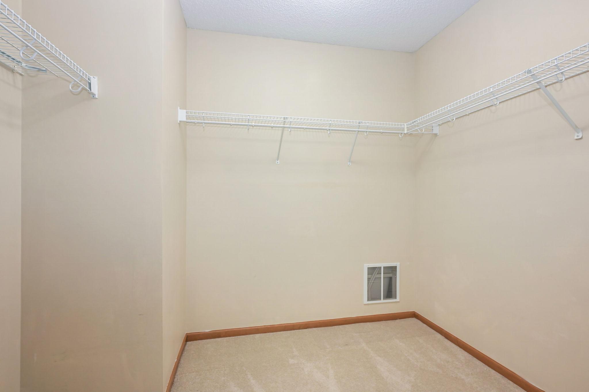 Walk in closet at primary bedroom