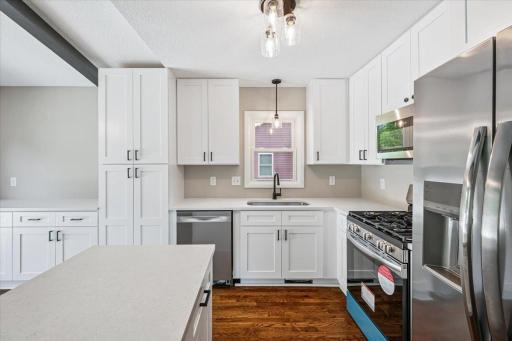 Brand new stainless steel appliances and quartz countertops.