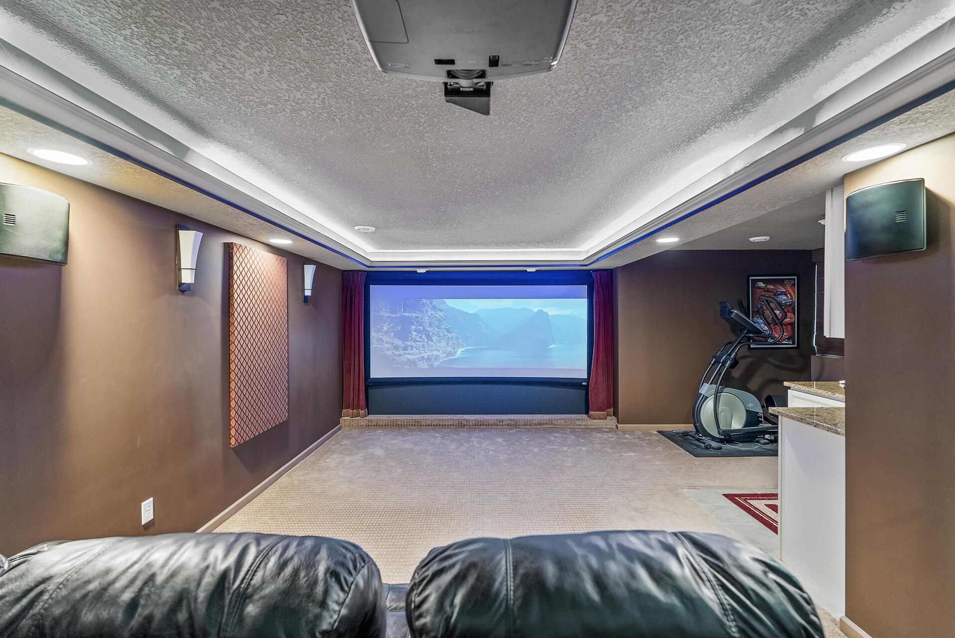 Photo is for illustration only. Chairs/Speakers/Sound panels does not stay with the home.