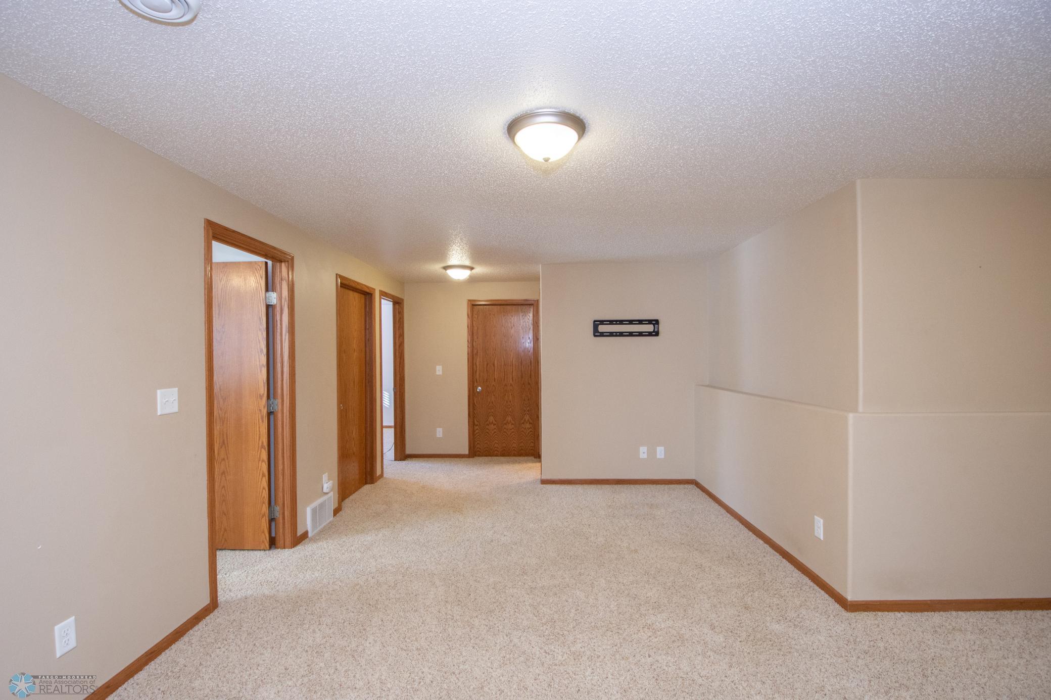 Lower level bedroom and laundry room from family room