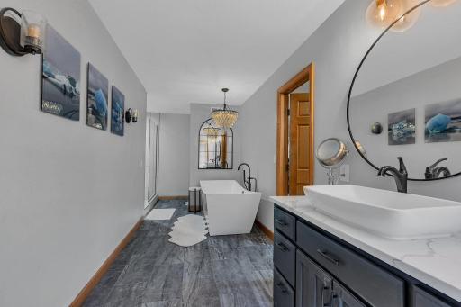 A soaking tub of your dreams, double vanity and custom tiled shower ~ reminiscent of a luxury hotel!